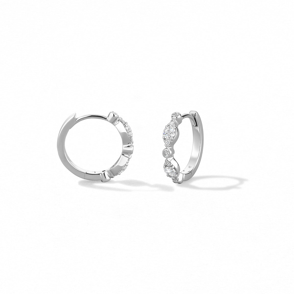 Video Thumbnail: Hearts on Fire White Gold Bezel Regal Huggie Style Earrings Diamonds 0 36 Carat Total Weight Vs Si Clarity G H Colour - Hof 18kw Gold Bezel Regal Huggie Earrings