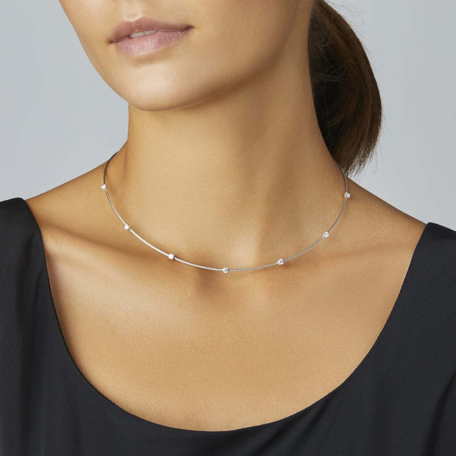 PAUL MORELLI 18K YELLOW GOLD 1MM WIRE NECKLACE WITH 7 ROUND 0.70 CARAT WEIGHT DIAMONDS.