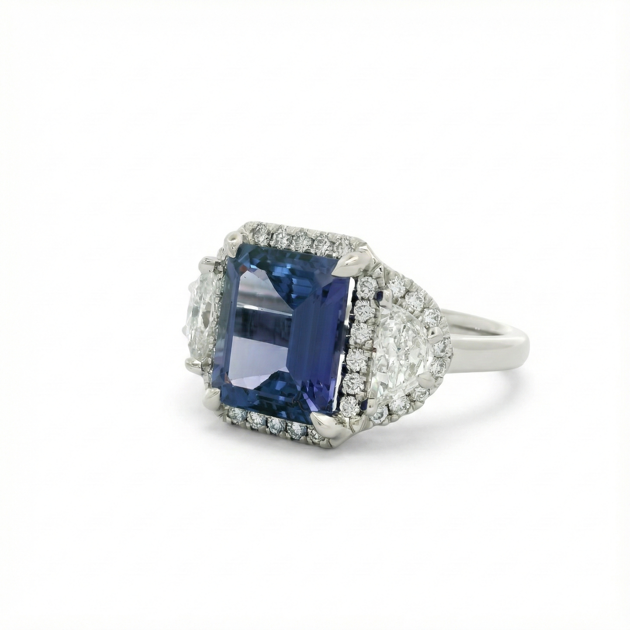 Platinum Tanzanite and Diamond Accented Three-Stone Ring