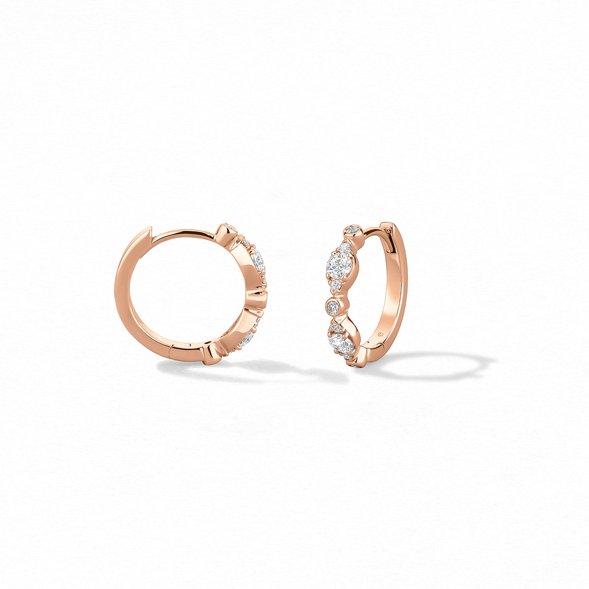 Video Thumbnail: Hearts on Fire Rose Gold Bezel Regal Huggie Style Earrings Diamonds 0 36 Carat Total Weight Vs Si Clarity G H Colour - Hof 18kr Gold Bezel Regal Huggie Earrings
