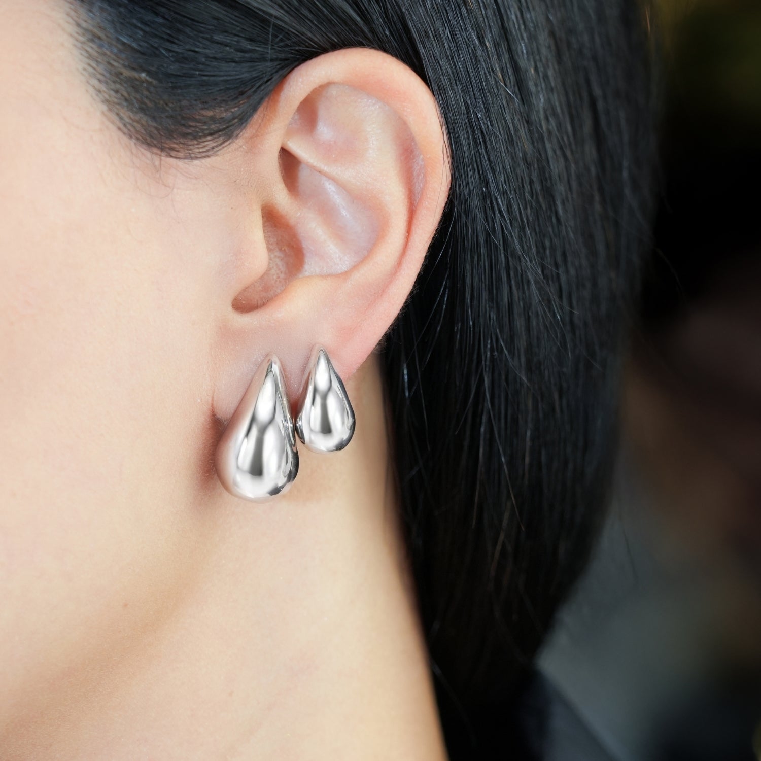 Teardrop Huggie Style Earrings Cast In 18K White Gold
