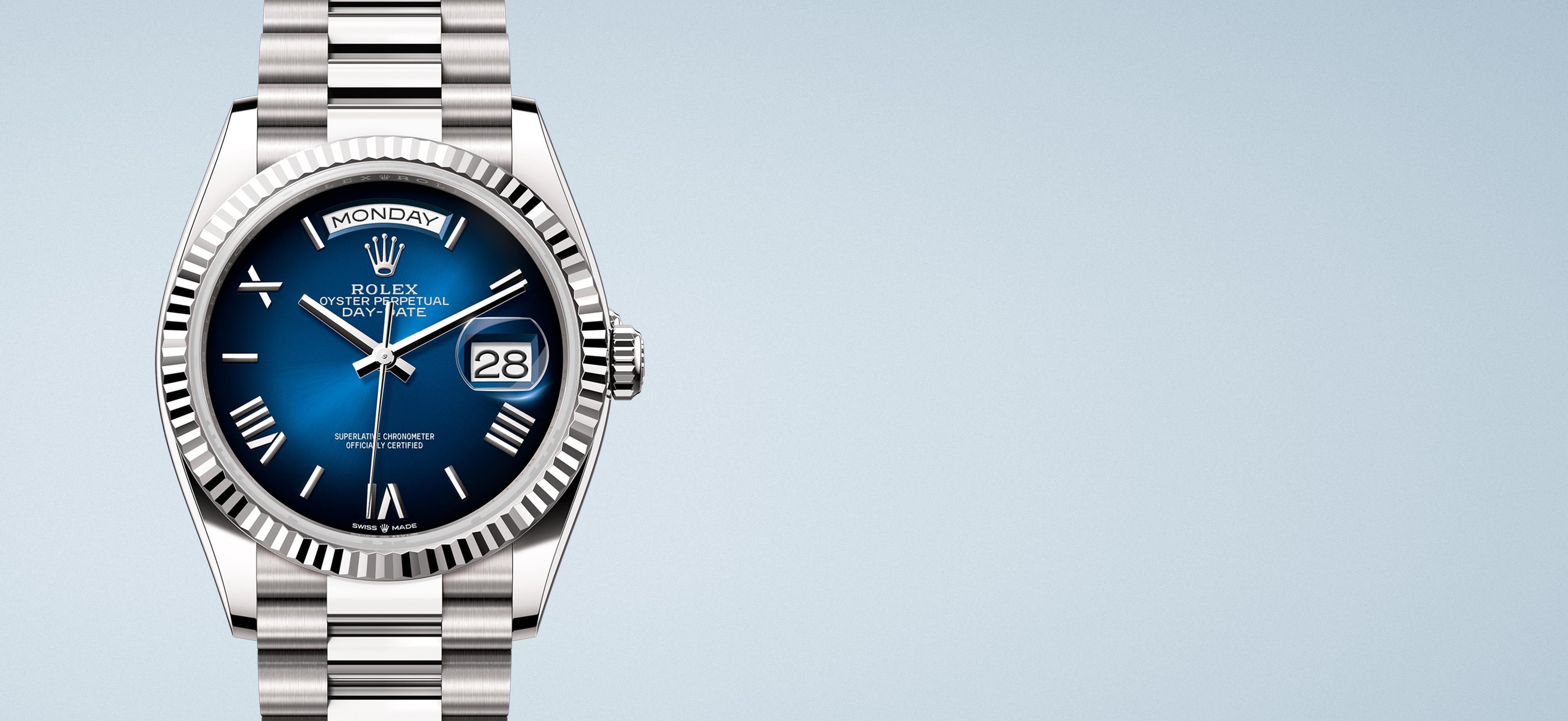 Luxurious Rolex Day-Date in solid 18 carat white gold with a blue dial on a light bluish-grey background