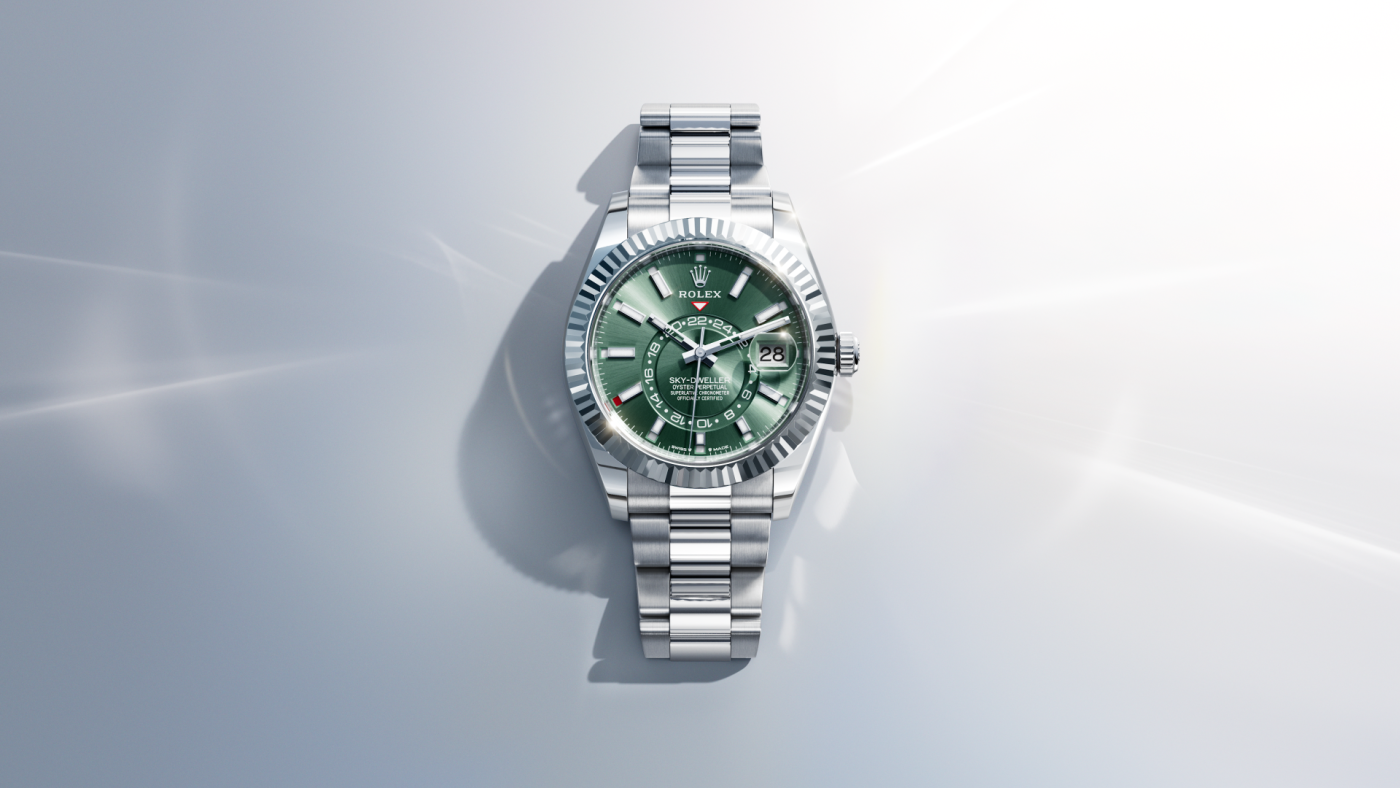 A video showcasing the Rolex Sky-Dweller. The thumbnail preview depicts a full, front view of a Rolex Sky-Dweller in Oystersteel with a green dial, set against an abstract white background.