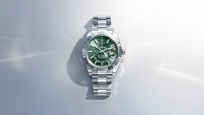A video showcasing the Rolex Sky-Dweller. The thumbnail preview depicts a full, front view of a Rolex Sky-Dweller in Oystersteel with a green dial, set against an abstract white background.