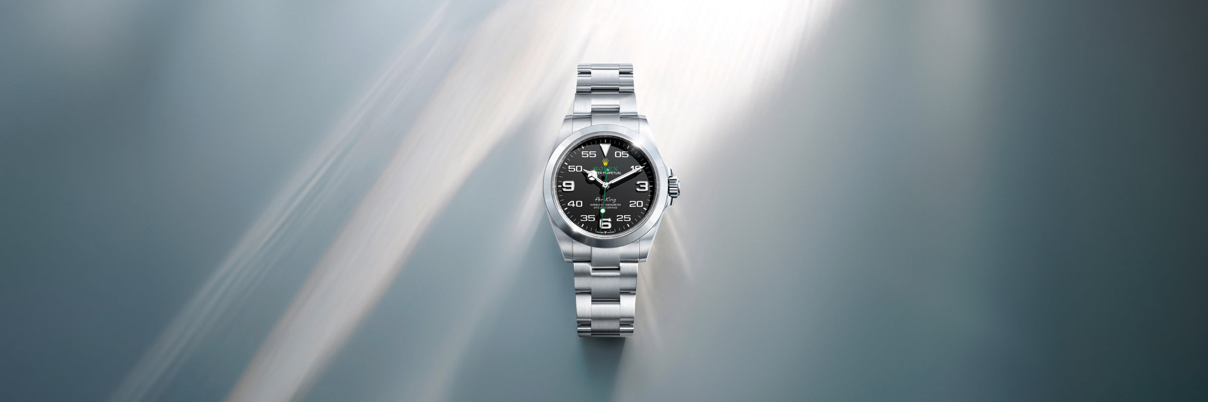 Rolex Air-King with a black dial on a reflective surface
