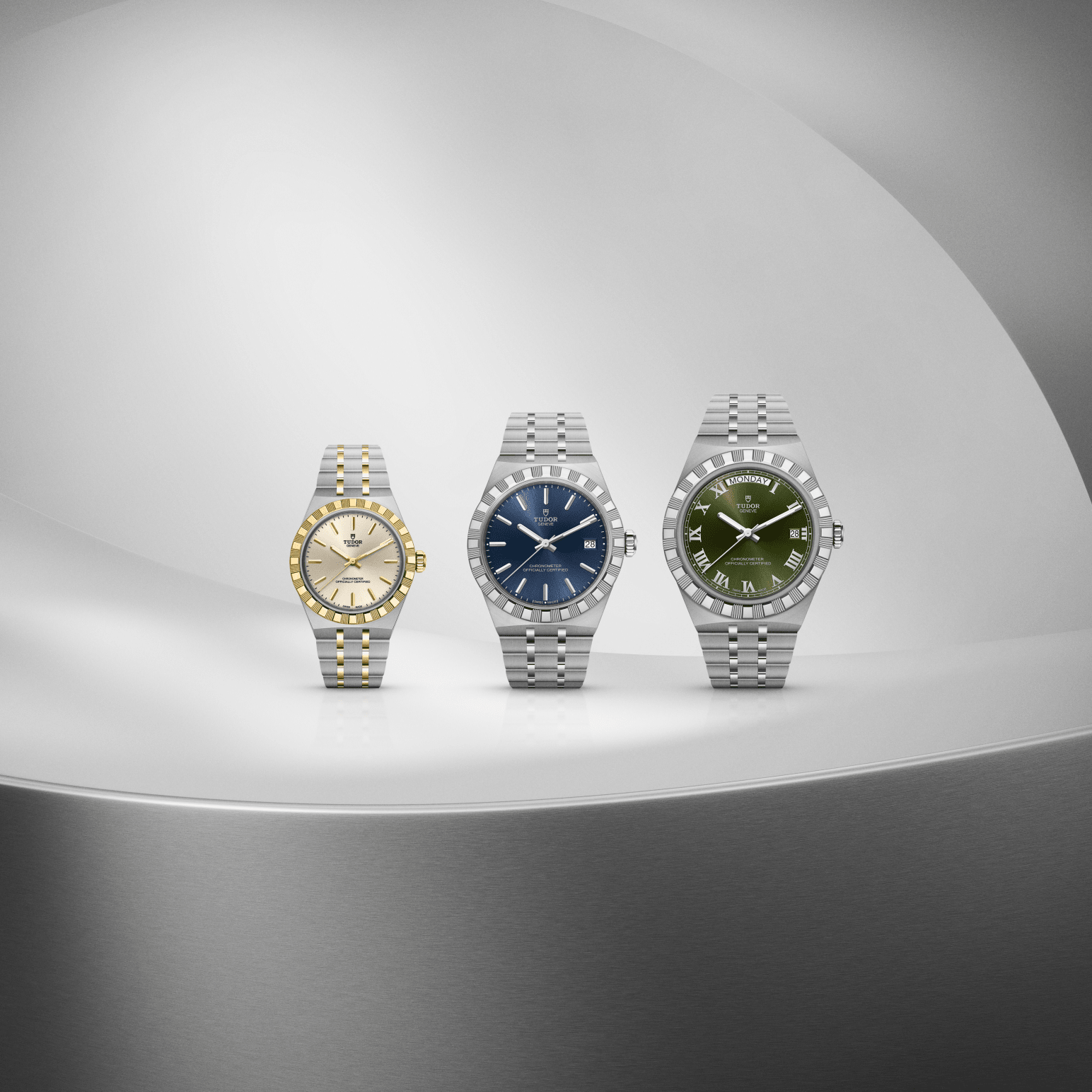 Three sizes of the Tudor Royal lined up against a silver background composed of various curves.